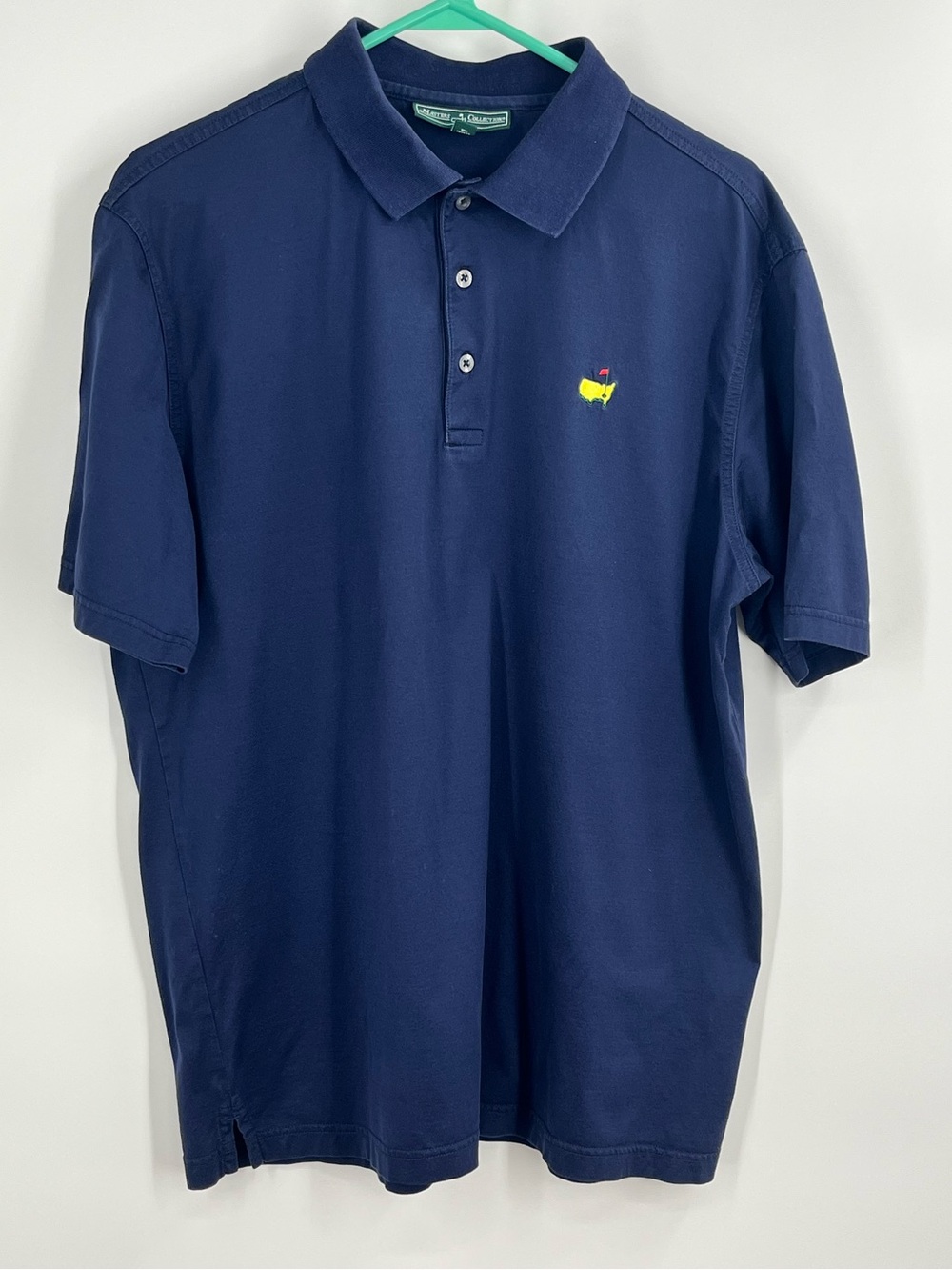 Masters Collection navy blue polo. Size large. Gently worn.